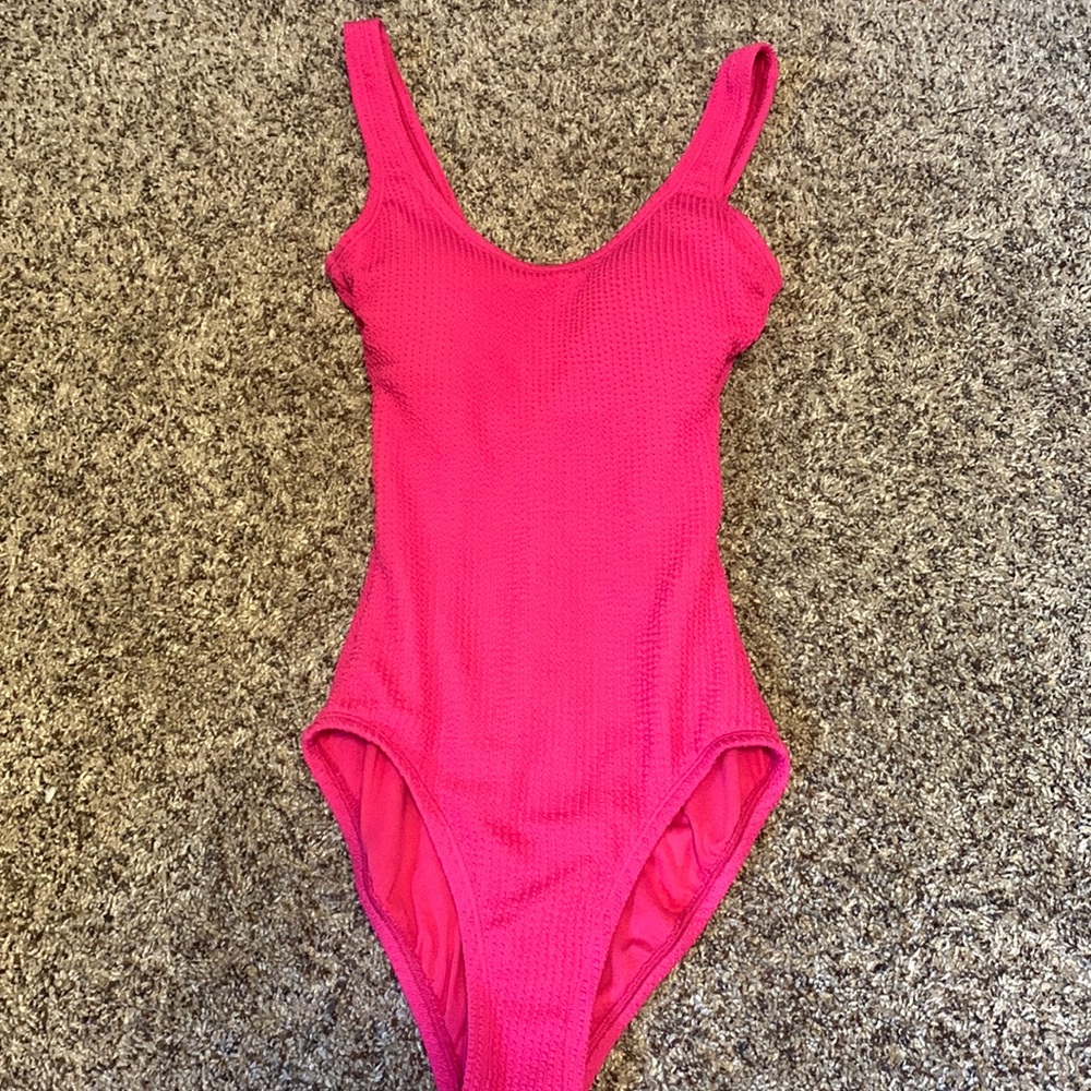 One piece hot pink bathing suit, never worn, doesn’t have tags